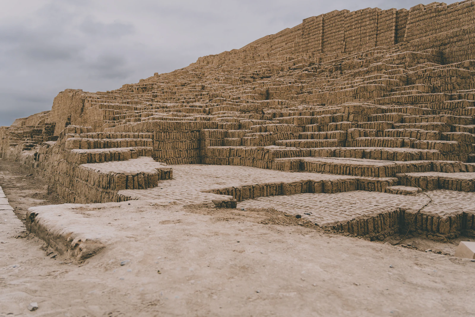 Huaca Pucllana ancient pyramid ruins illuminated at night in Lima