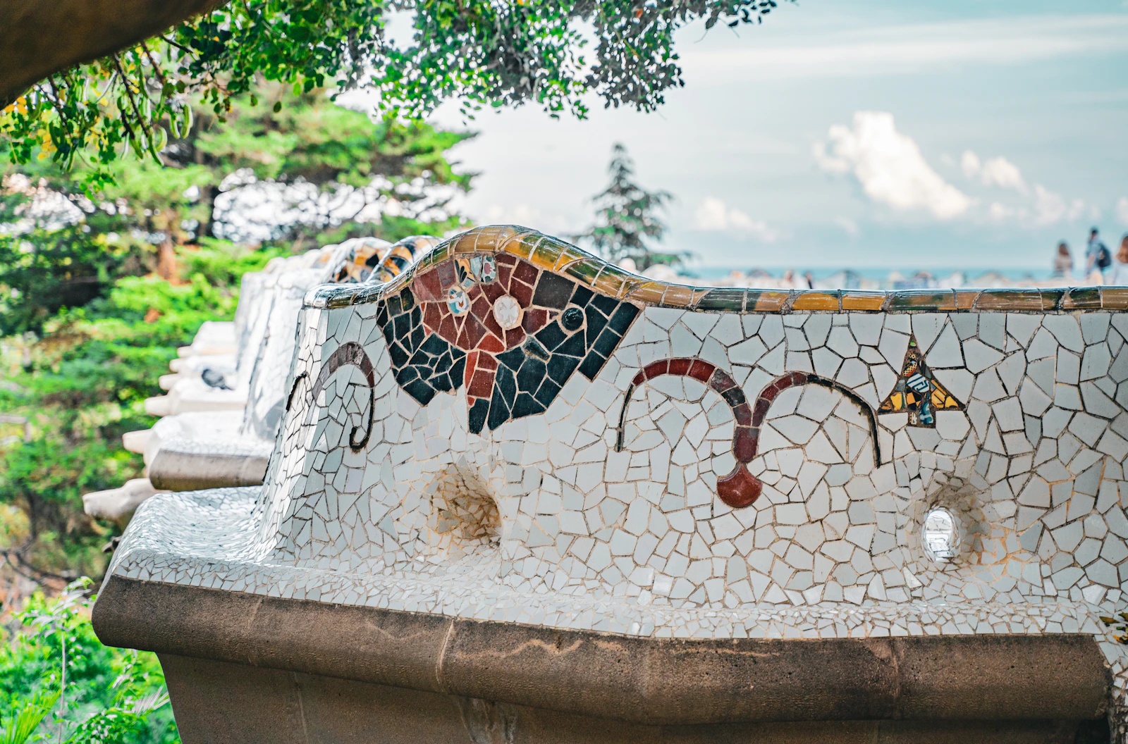 Colorful mosaic bench at Park Güell by Antoni Gaudí in Barcelona