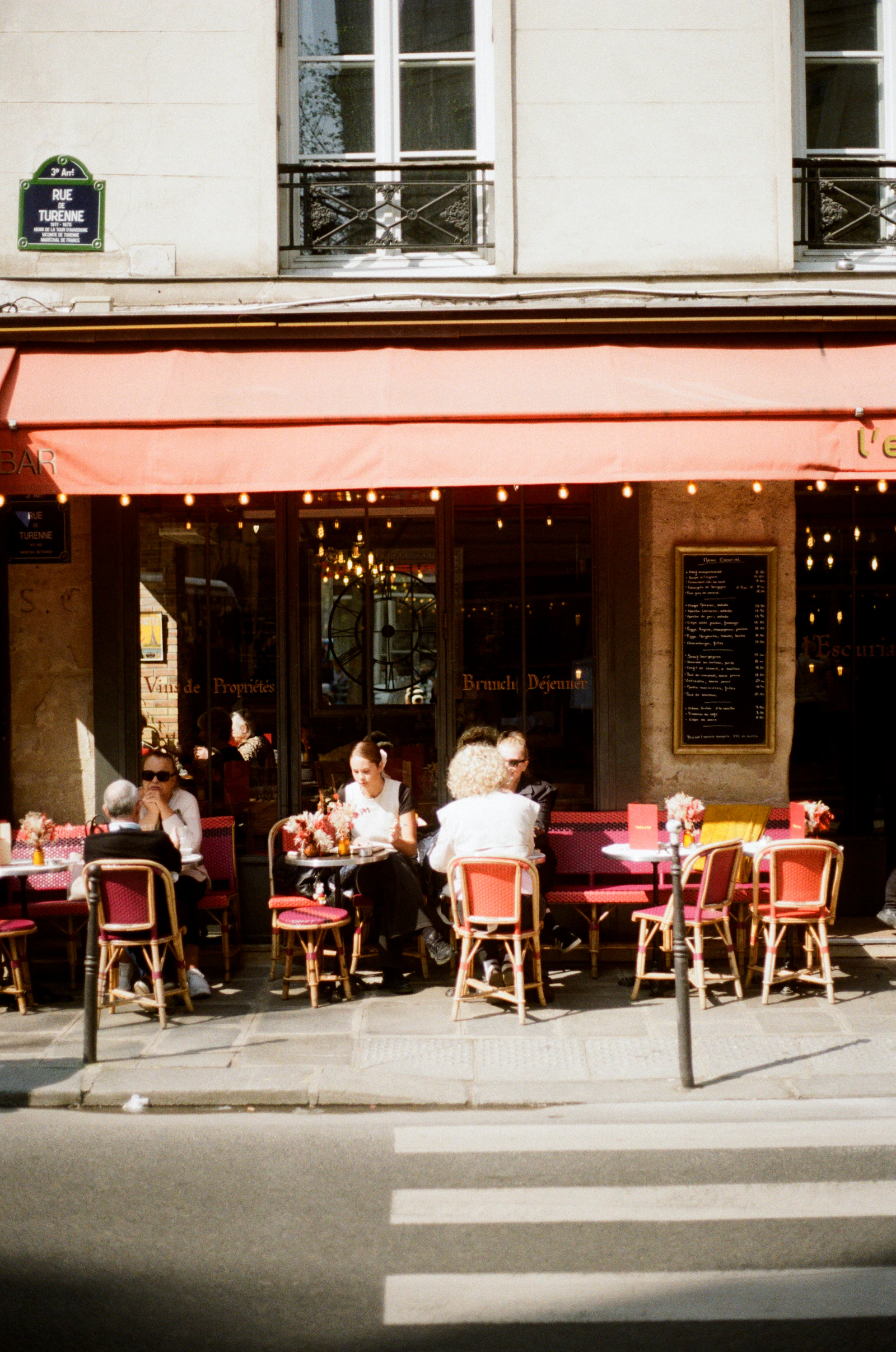 Charming Paris street with outdoor café dining