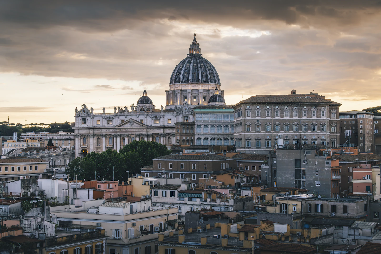 St. Peter's Basilica dome over Rome skyline at sunset