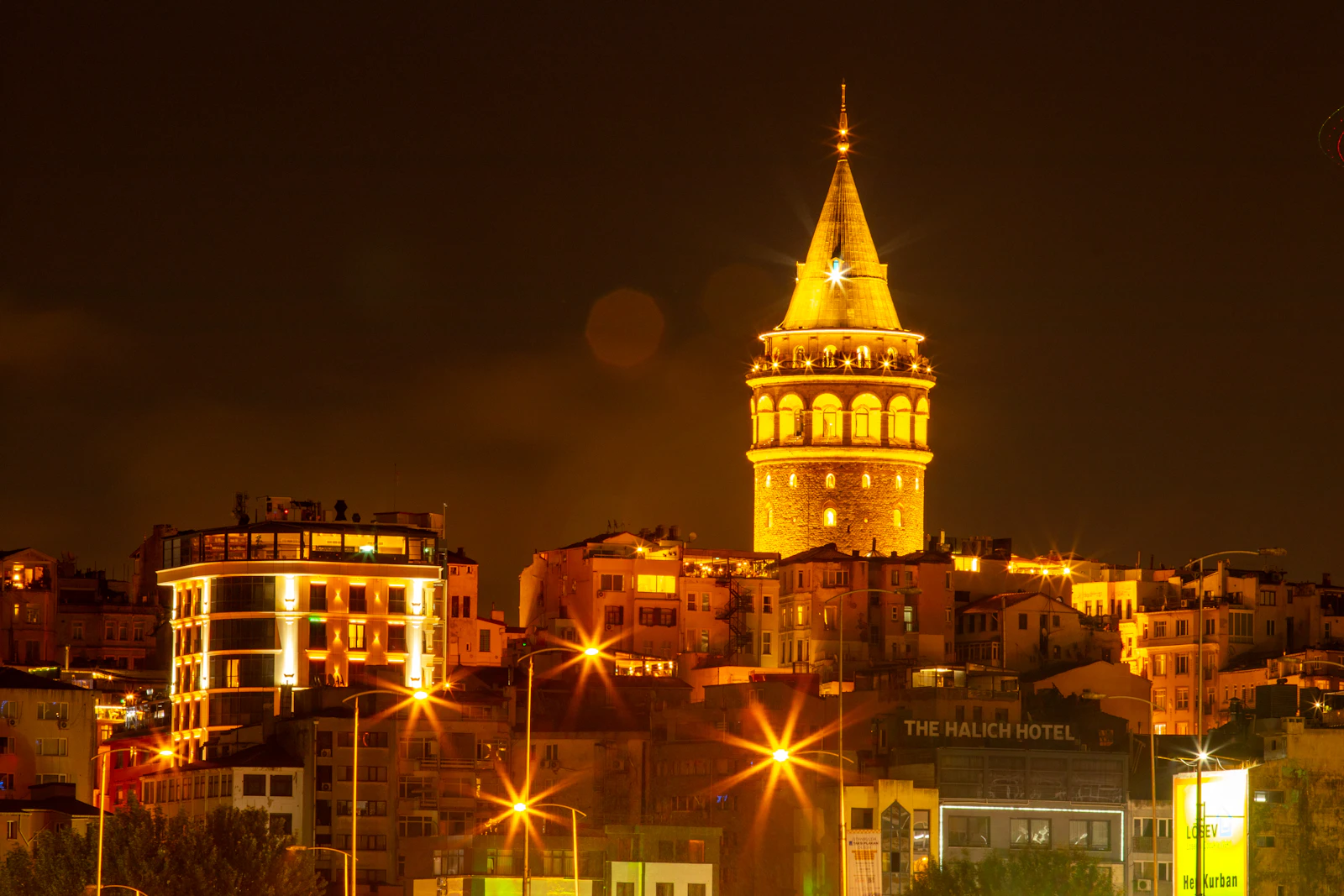 Galata Tower illuminated at night in Istanbul