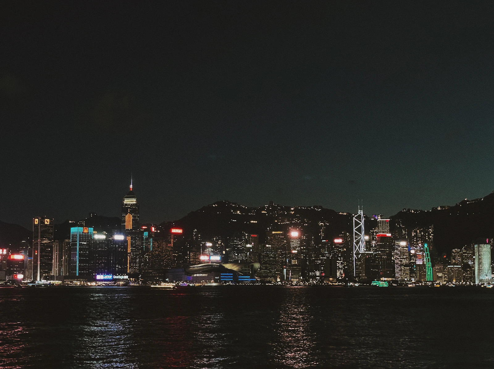 Hong Kong cityscape with illuminated skyscrapers at night