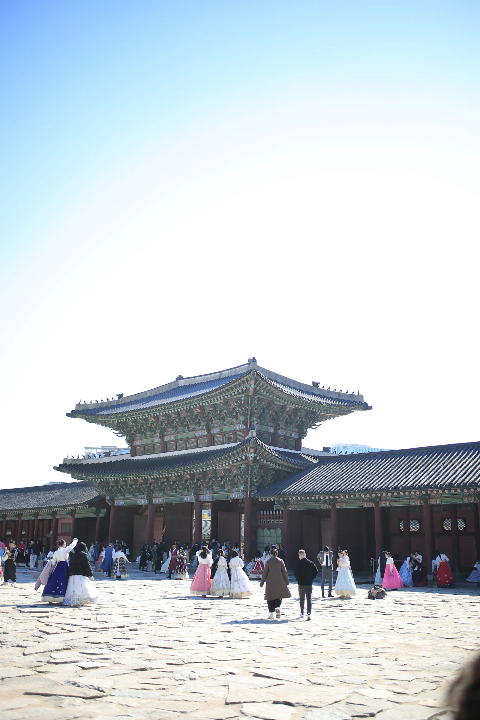 People in traditional hanbok at Gyeongbokgung Palace