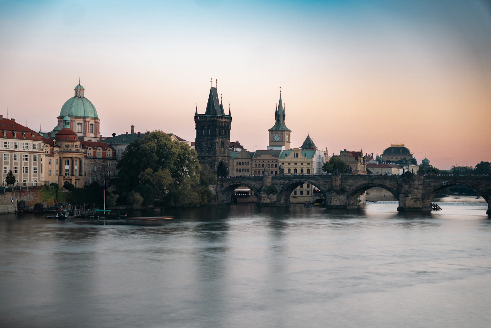 Charles Bridge over the Vltava River in Prague at dawn